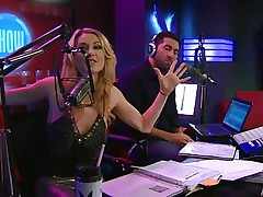 Playboy Radio's Morning Show has some of the hottest women you've ever seen! They're talking about Halloween costumes, and their guest has a cop outfit on that looks hawt as hell. It gets even sexier when her top comes off, baring her tits. The female host comes over and helps shorten the skirt.