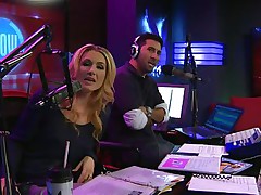 The hosts of Playboy Radio's Morning Show are looking at their guest model who is wearing the suit she'll be wearing to the Playboy Mansion for Halloween. Her head and tits are overspread in fake fruit like oranges, limes, lemons, and more. She flashes her breasts for the hosts and viewers.